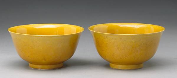 Appraisal: A pair of yellow glazed porcelain dragon bowls Kangxi Marks