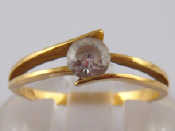 Appraisal: A yellow metal tests carat gold clear stone solitaire ring