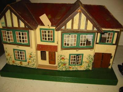 Appraisal: A Triang doll's house of painted wood construction hipped and