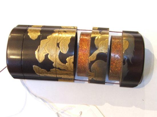 Appraisal: A JAPANESE LACQUERED SIX PART INRO decorated root vegetables