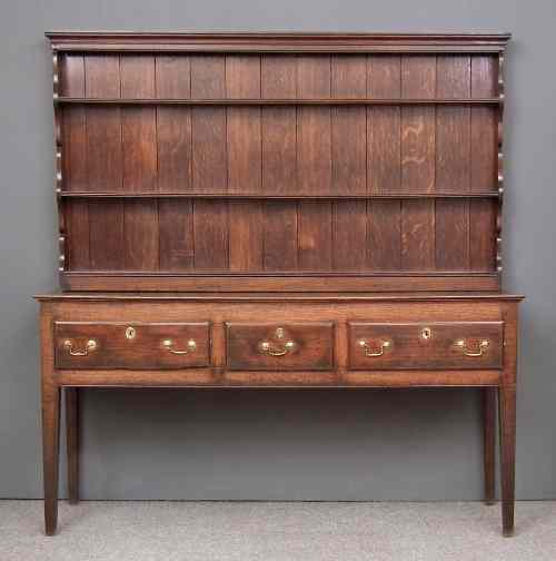 Appraisal: An th Century oak dresser the later upper part with