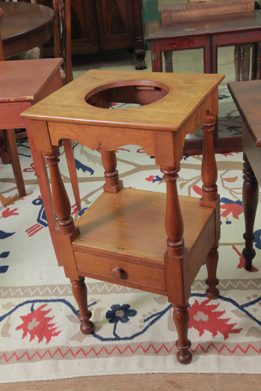 Appraisal: WASH STAND Cherry with shaped apron turned posts and a