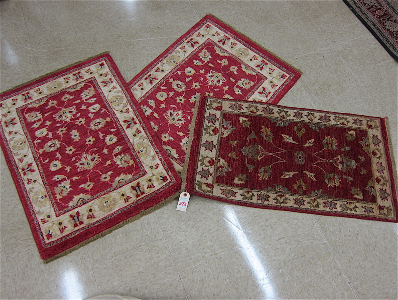 Appraisal: THREE SIMILAR ORIENTAL MATS Pakistani-Persians floral design on madder red