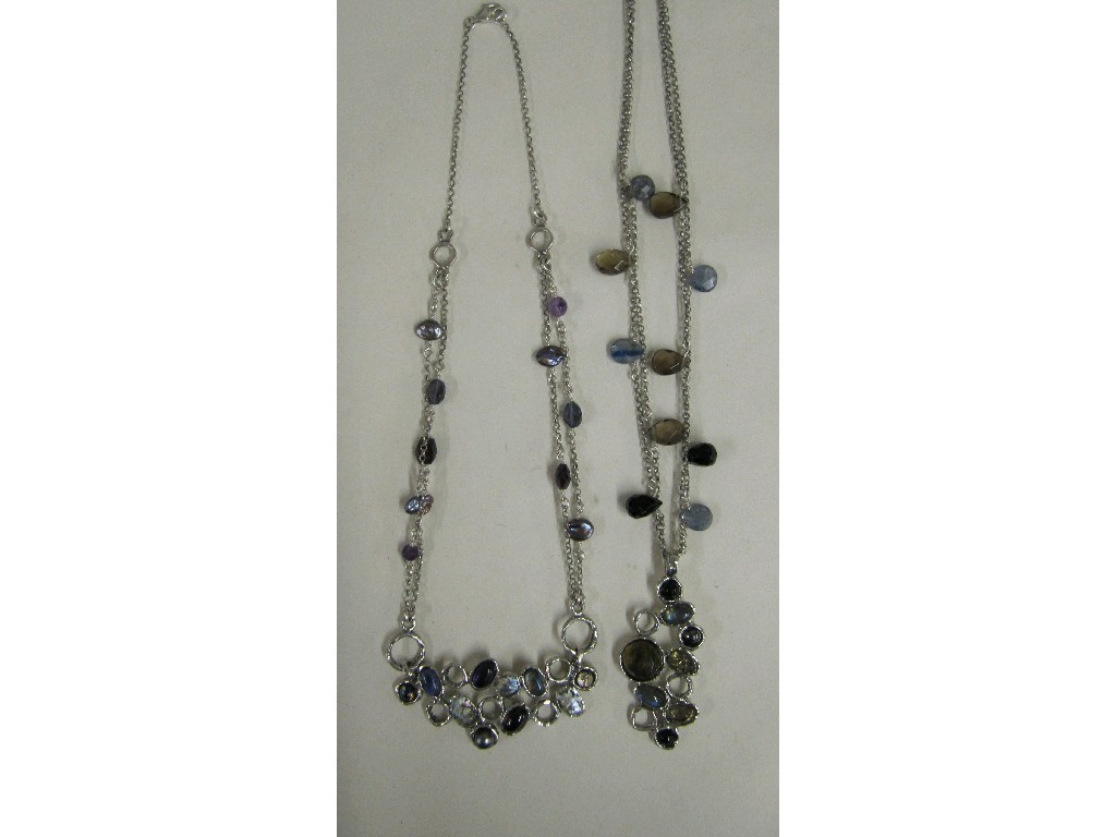 Appraisal: Two silver pendant necklaces with shell and quartz bead spacers