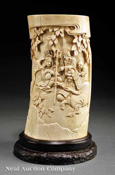 Appraisal: A Large Chinese Carved Ivory Brush Holder relief-carved with figures