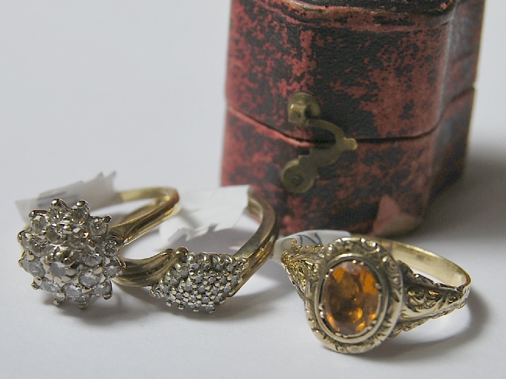 Appraisal: Three stone set rings including diamond set ballerina-style cluster yellow