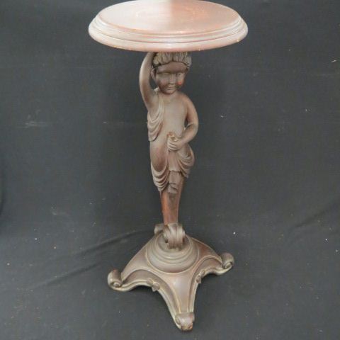 Appraisal: Carved Mahogany Figural Plant Stand young child in toga footed