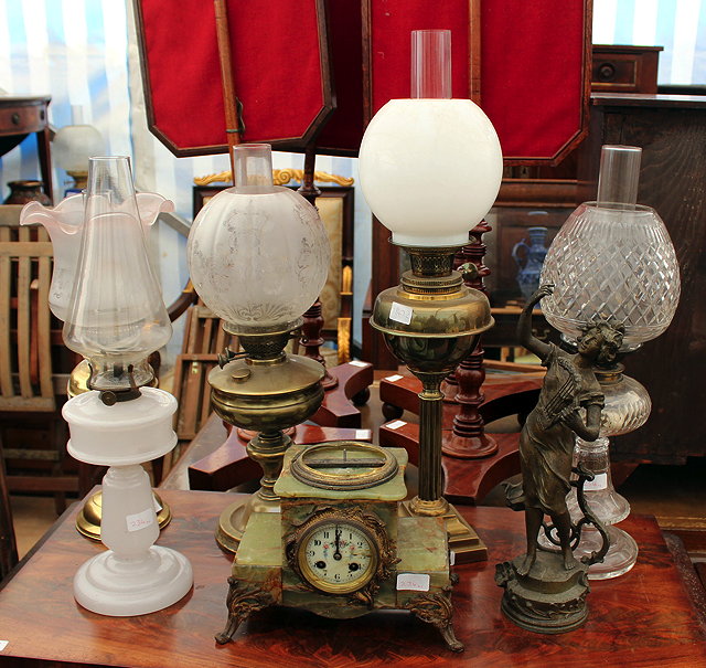 Appraisal: FIVE VICTORIAN AND LATER OIL LAMPS together with green onyx