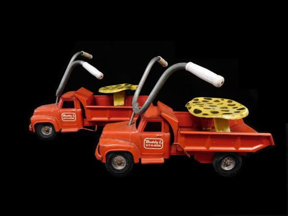 Appraisal: Pair of red metal Buddy L sit-n-ride trucks c s