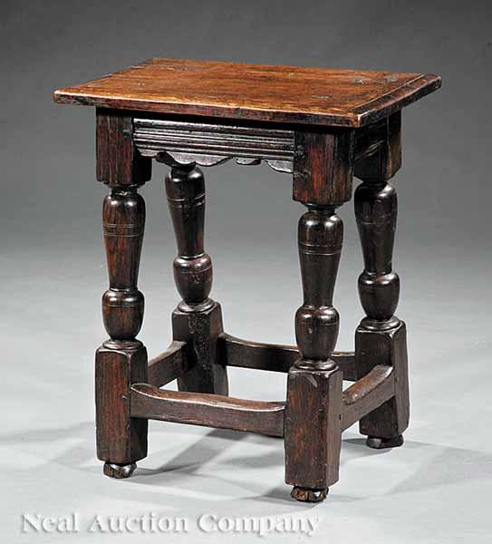 Appraisal: An Antique Jacobean-Style Carved Oak Stool th c plank top