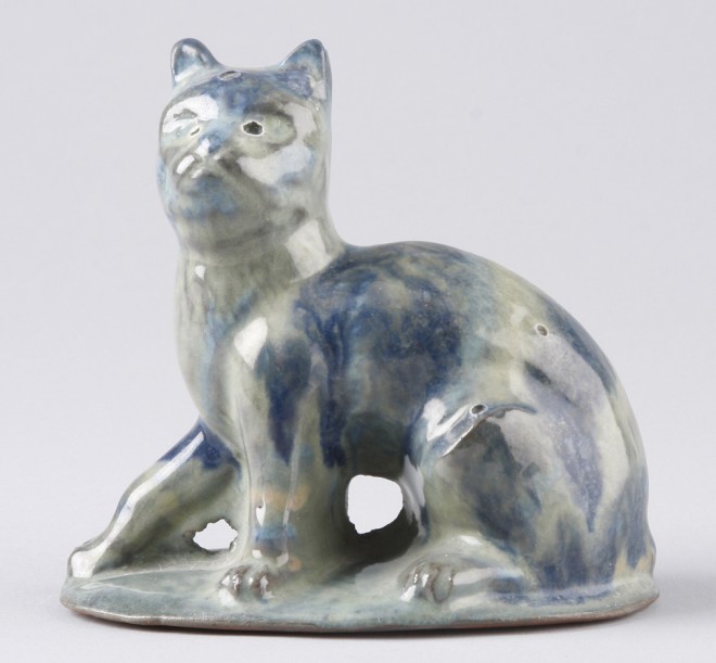 Appraisal: Redware cat features blue and green stripe glaze marked on