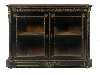 Appraisal: A FRENCH ORMOLU MOUNTED AND BRASS INLAID EBONISED CABINET enclosed