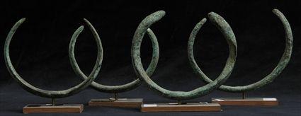 Appraisal: THIRTEEN LURISTAN BRONZE BRACELETS ON STANDS to in diam Provenance