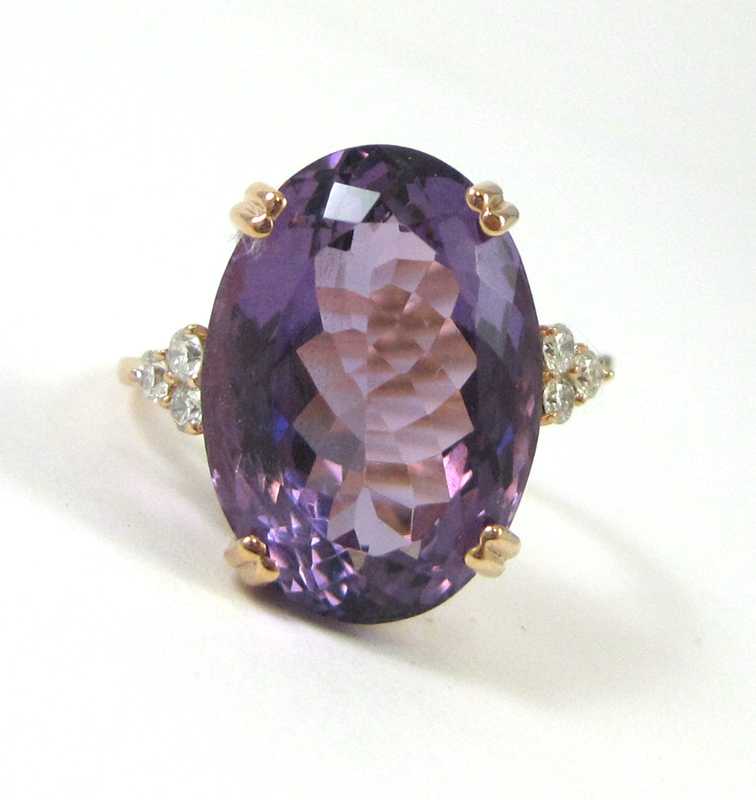 Appraisal: AMETHYST AND FOURTEEN KARAT ROSE GOLD RING with three round-cut