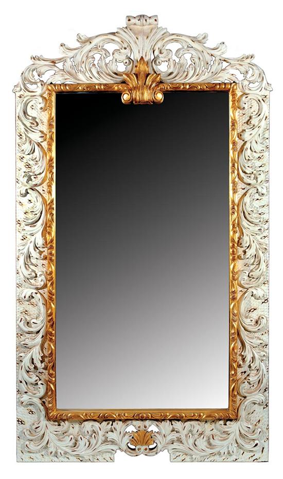 Appraisal: Gilded and painted hall mirror pierce-carved crest with rococo designs