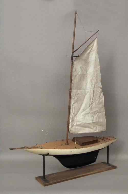 Appraisal: A mid th Century wooden pond yacht with cream and