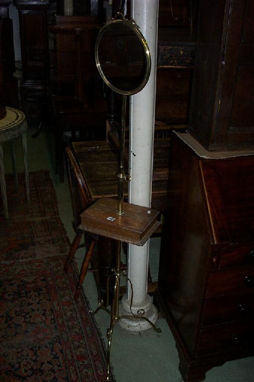 Appraisal: A Victorian brass shaving stand with adjustable column mahogany box