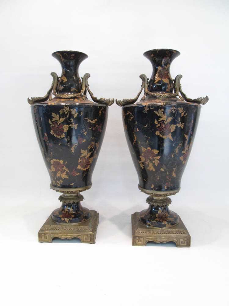 Appraisal: TWO MARK ROBERTS PORCELAIN URNS having black glazed floral bodies