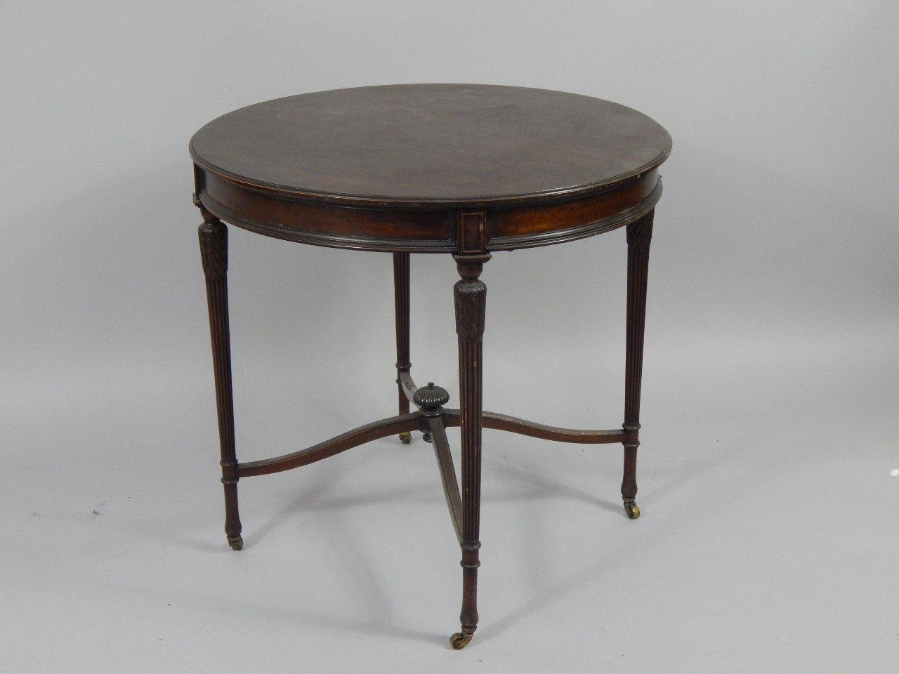 Appraisal: A Victorian mahogany circular occasional table raised on lappet carved