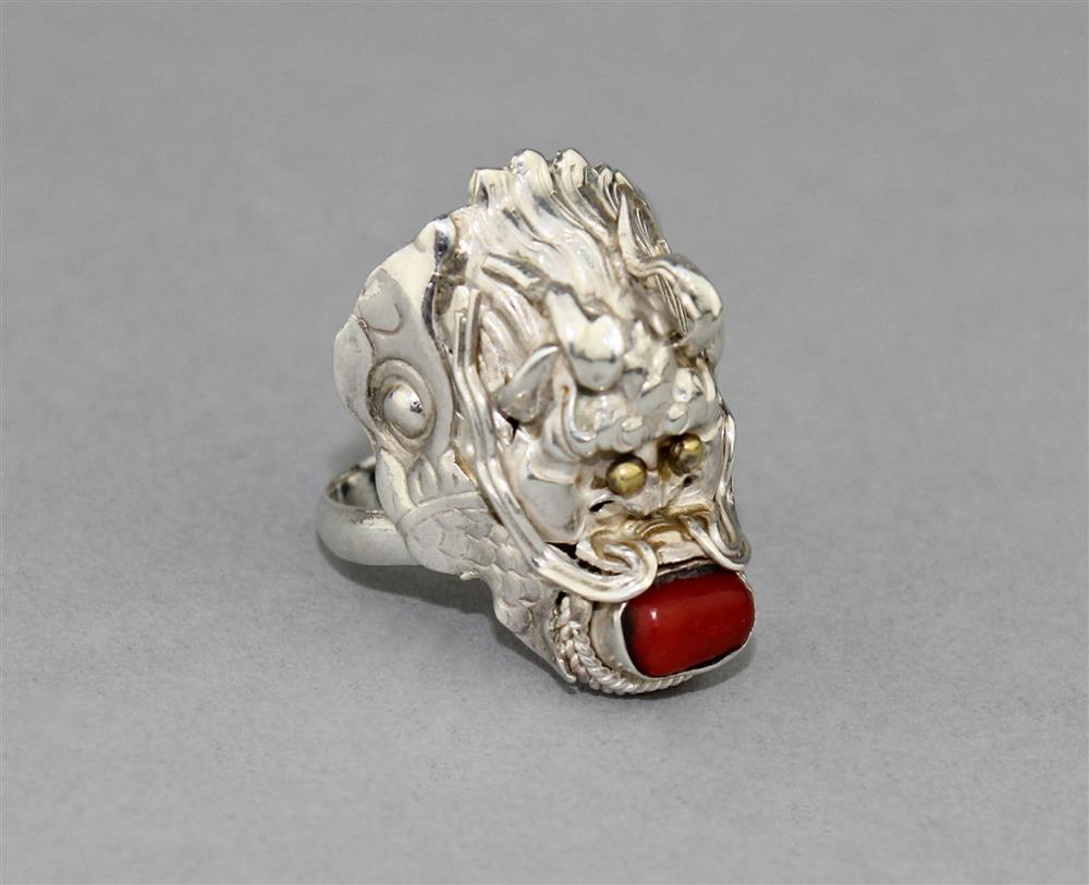 Appraisal: STERLING SILVER DRAGON RING WITH CORAL the ring is marked