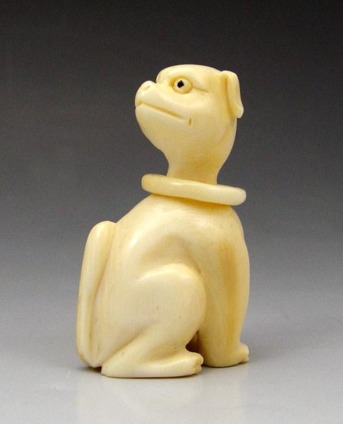 Appraisal: CARVED IVORY DOG NETSUKE Carved dog with loose collar signed