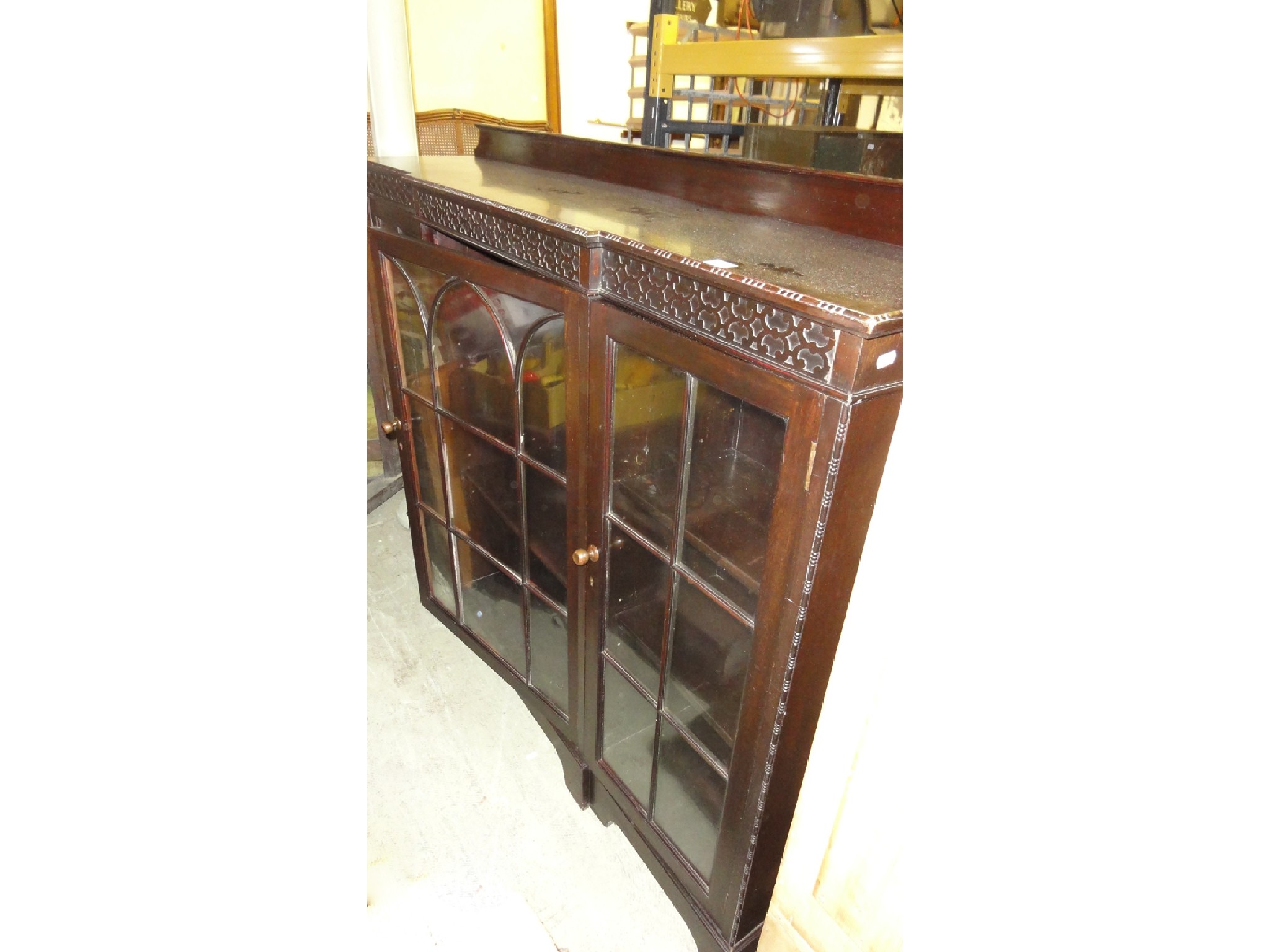 Appraisal: An Edwardian mahogany side cabinet with shallow breakfront and blind