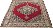 Appraisal: A Bijar Carpet A bright red ground features a diamond