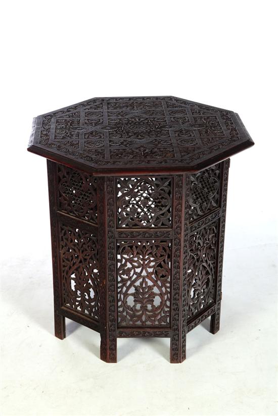 Appraisal: CARVED SIDE TABLE Indonesia mid th century teak Carved octagonal