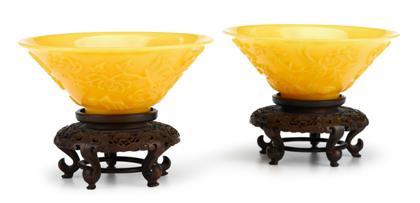 Appraisal: Pair of Chinese carved imperial yellow glass conical bowls on