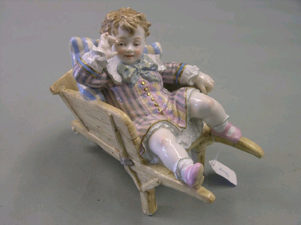 Appraisal: A th century continental porcelain model of a young child