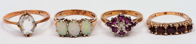 Appraisal: Collection of four ct gold ringsvarious settings one triple opal