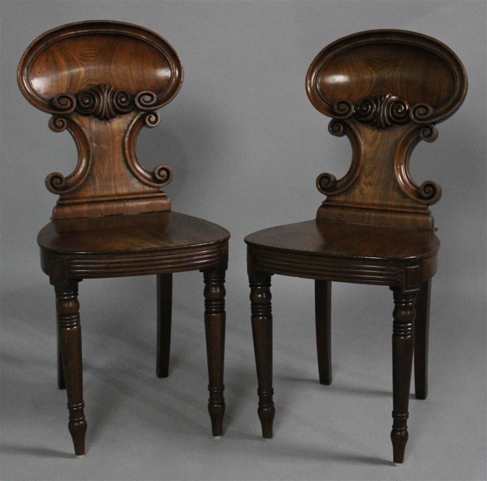 Appraisal: PAIR OF EARLY VICTORIAN CARVED MAHOGANY HALL CHAIRS each with