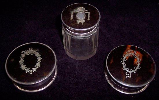 Appraisal: A pair of tortoiseshell mounted trinket boxes and a matching