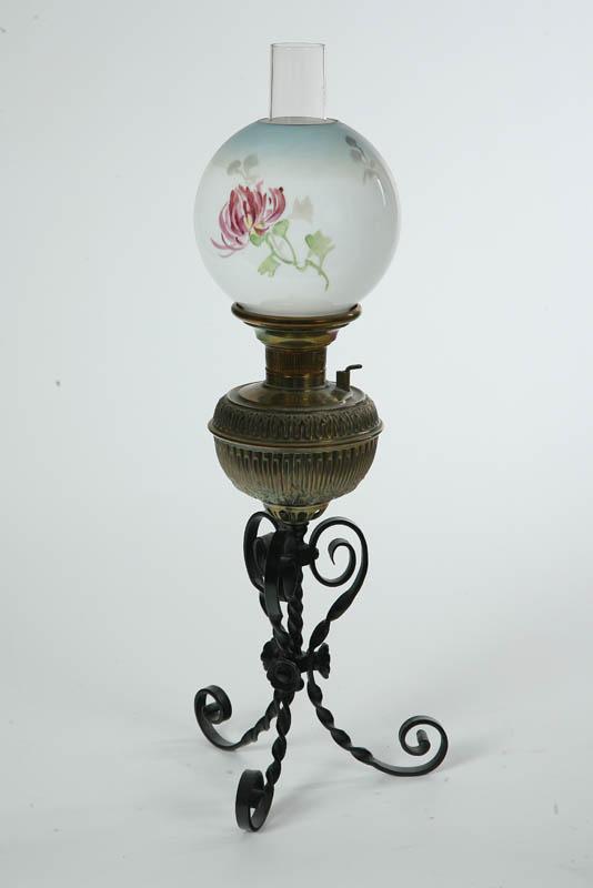 Appraisal: BRADLEY HUBBARD OIL LAMP Wrought iron twisted tripod base with