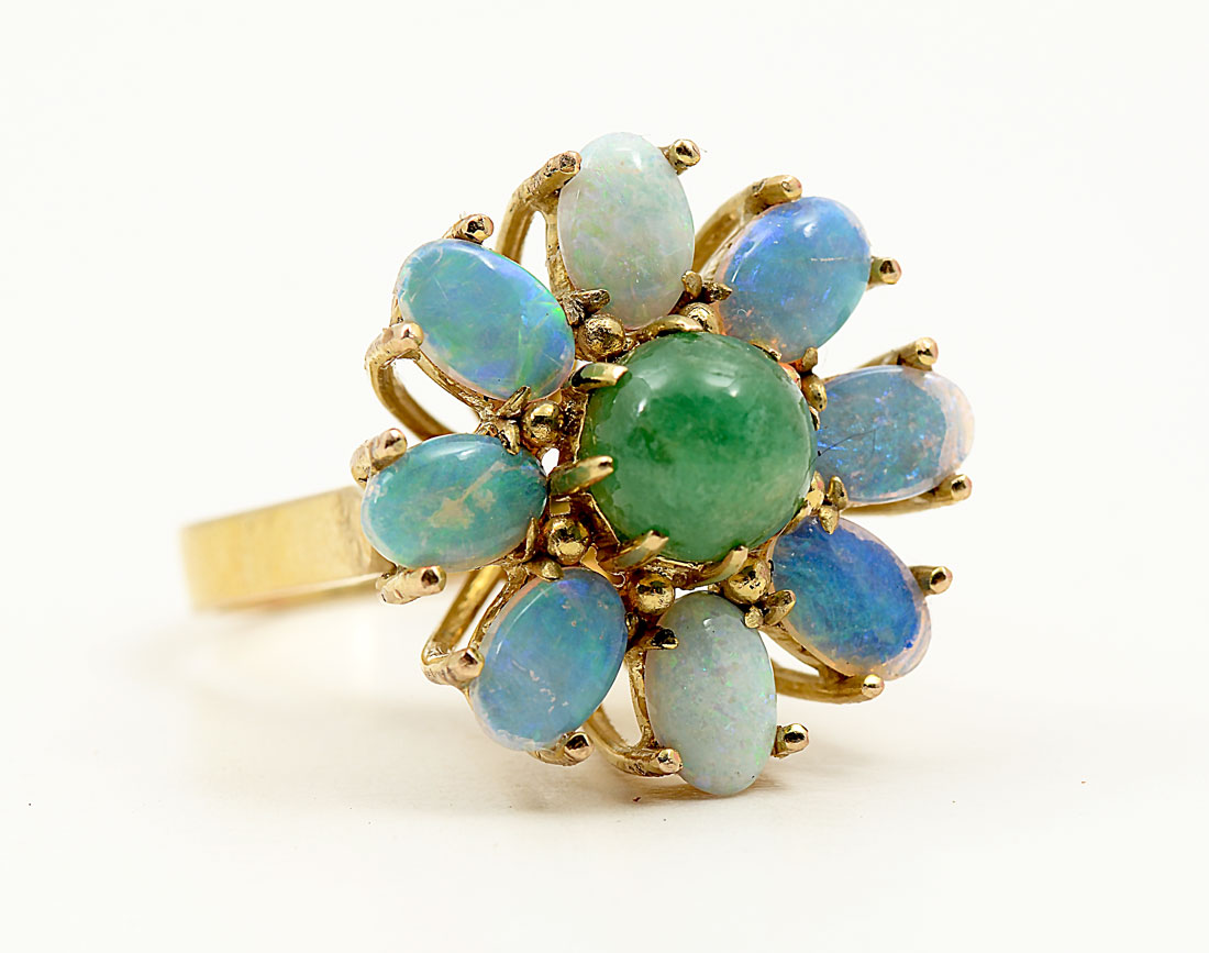 Appraisal: K OPAL EMERALD RING K yellow gold ring contains oval