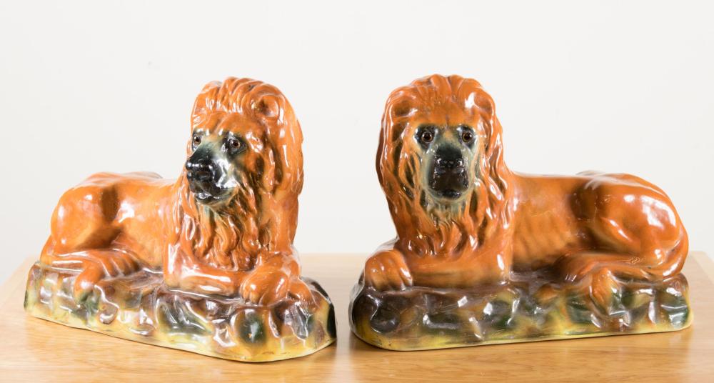 Appraisal: LARGE PAIR OF TH CENTURY STAFFORDSHIRE LIONS in opposing positions