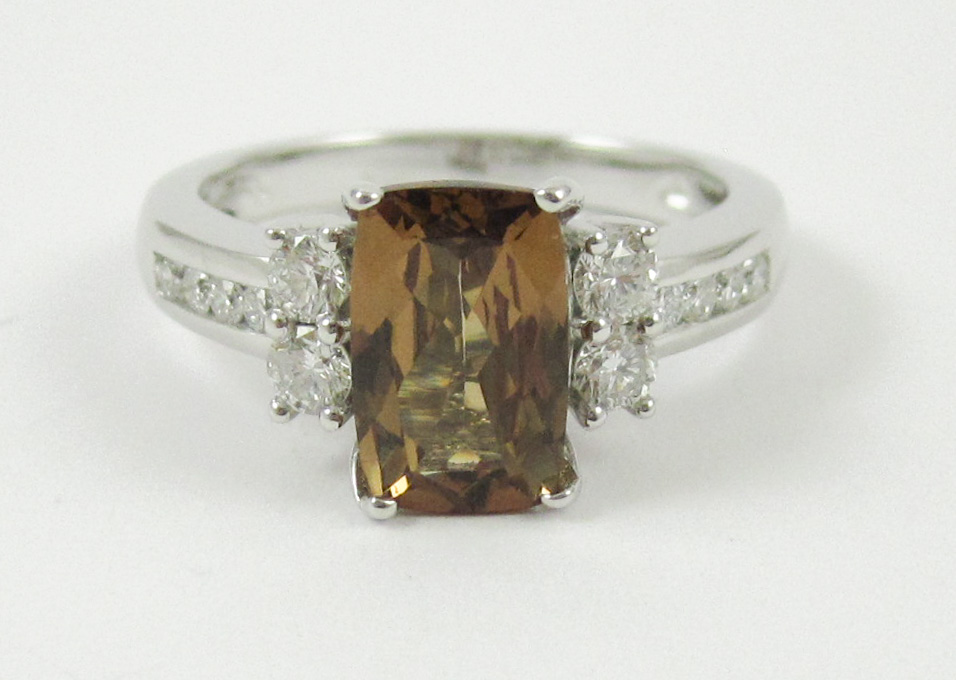 Appraisal: HESSONITE DIAMOND AND FOURTEEN KARAT WHITE GOLD RING with six