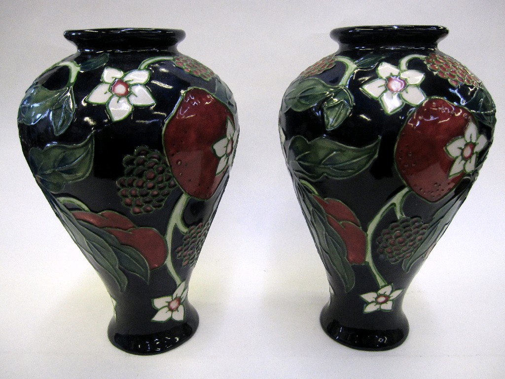 Appraisal: Pair of Moorcroft style vases with tubelined decoration of fruit