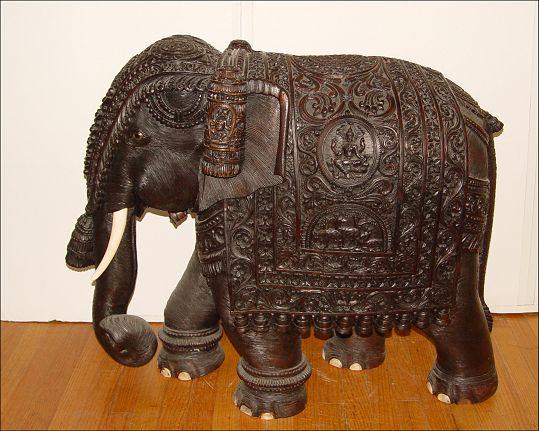 Appraisal: HUGE PROFUSELY CARVED MAHOGANY ELEPHANT Measures '' h x ''