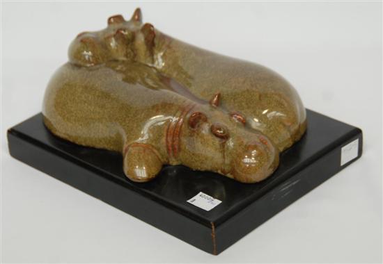 Appraisal: ART POTTERY FIGURAL GROUP Glazed pottery depicting hippos on an