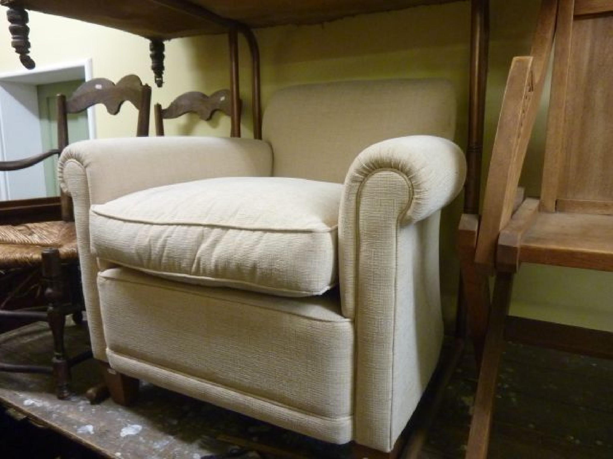 Appraisal: A contemporary club chair in the Edwardian style with scrolled