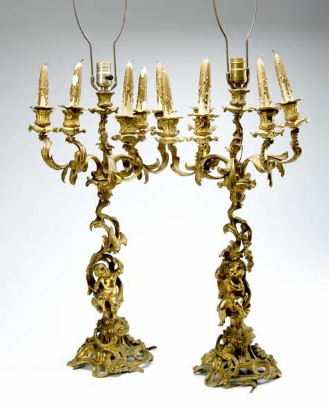 Appraisal: PAIR OF GILT CANDELABRA Six light candelabra with a cherub