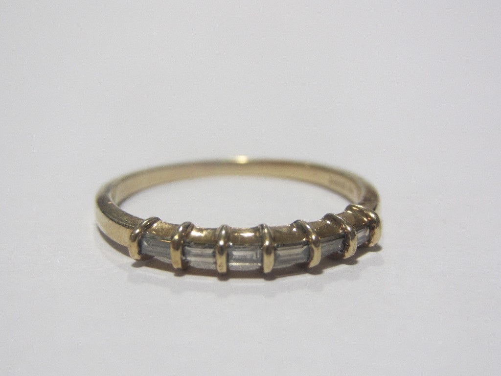 Appraisal: Nine carat gold baguette cut champagne diamond half hoop ring