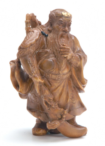 Appraisal: JAPANESE NETUSKE Elaborately carved boxwood netsuke of a Chinese general