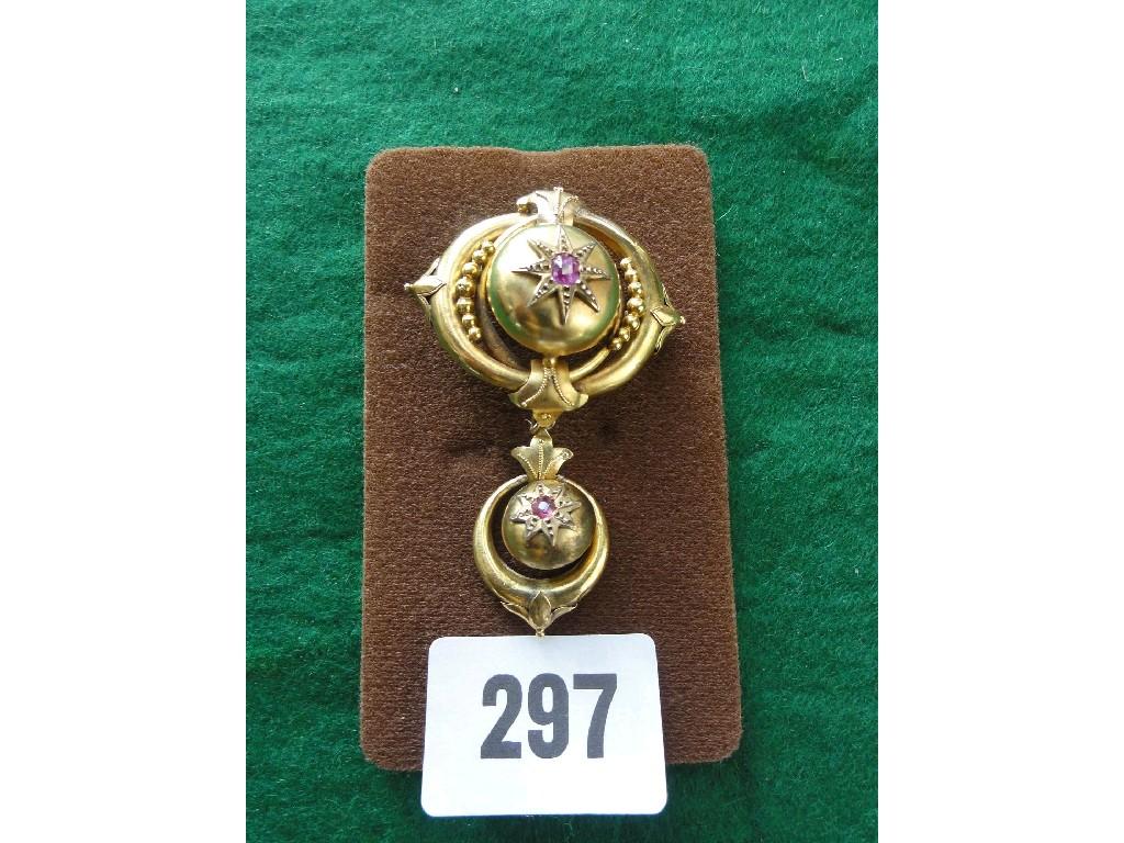 Appraisal: A Victorian pinchbeck pendant with stylised amethyst setting