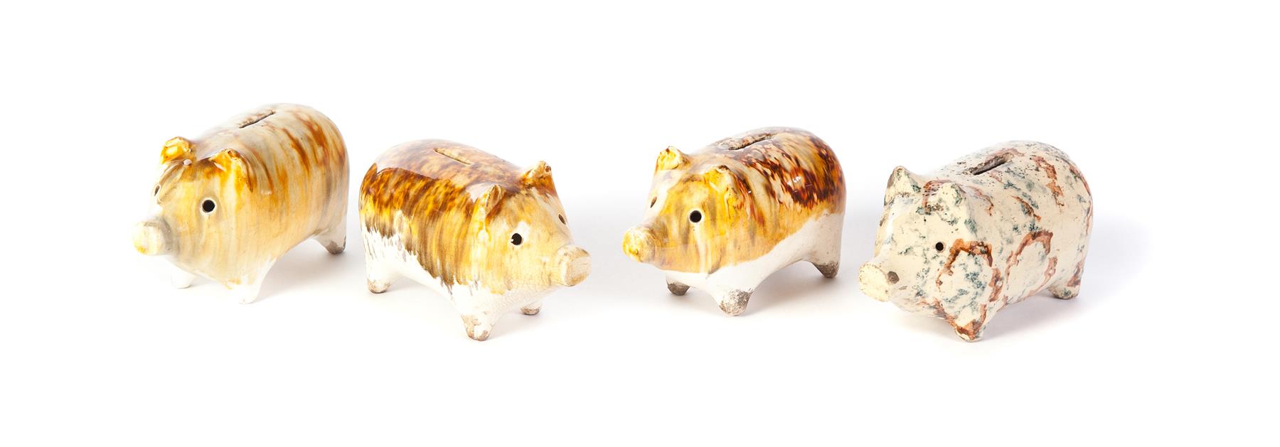 Appraisal: FOUR AMERICAN POTTERY PIGGY BANKS Second half- th century Yellow