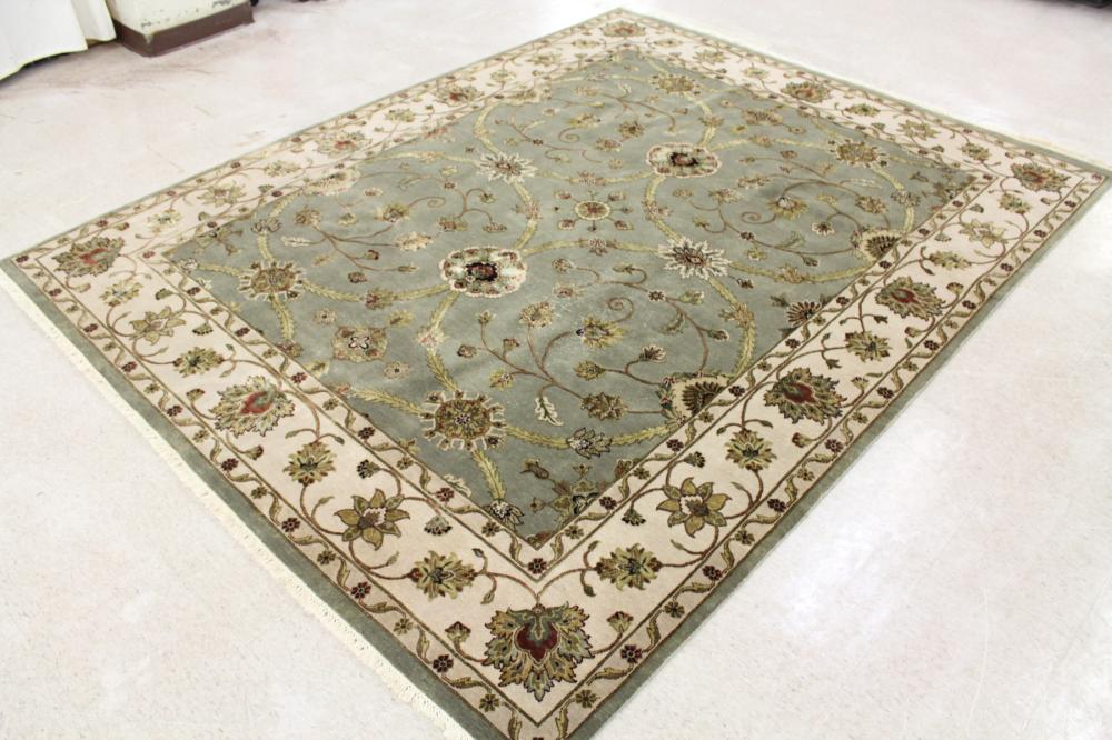 Appraisal: HAND KNOTTED ORIENTAL CARPET Indo-Persian overall floral design green ground