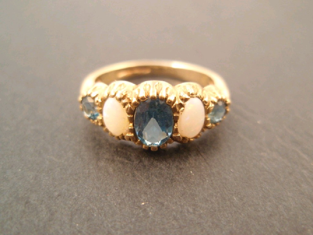 Appraisal: A boat shaped ct gold dress ring set with opals