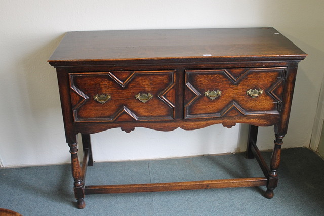 Appraisal: A SIMILAR SHORTER OAK DRESSER BASE with brass handles and