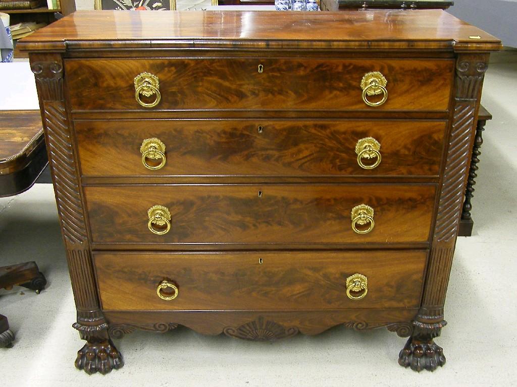 Appraisal: Empire style flamed mahogany chest of four long graduated drawers